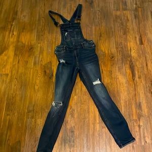 Distressed denim overalls